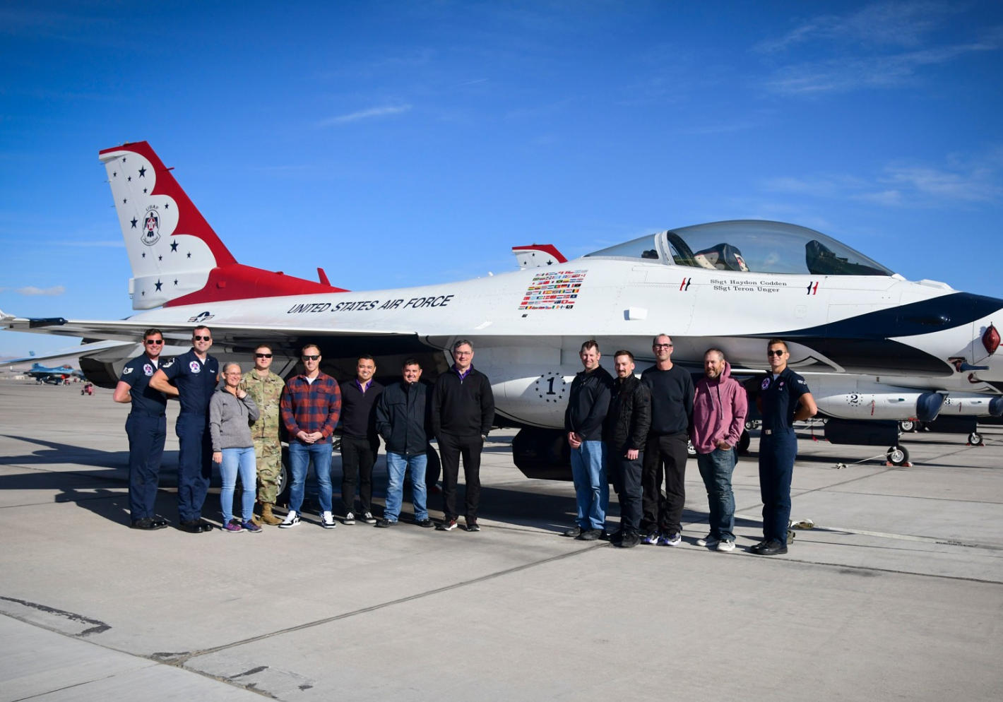 Hometown Hero - Group of individuals standing in front of Thunderbirds Plane