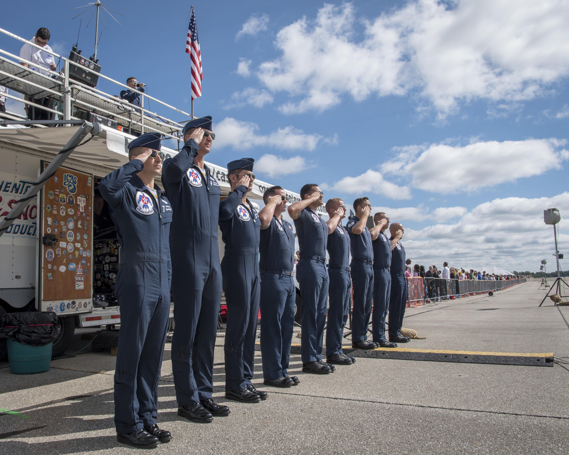 Salute to Service - Service members standing in a line saluting.